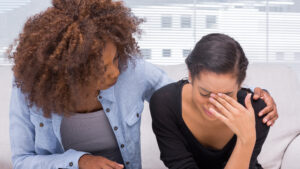 A woman is sad after meeting a sex offender.