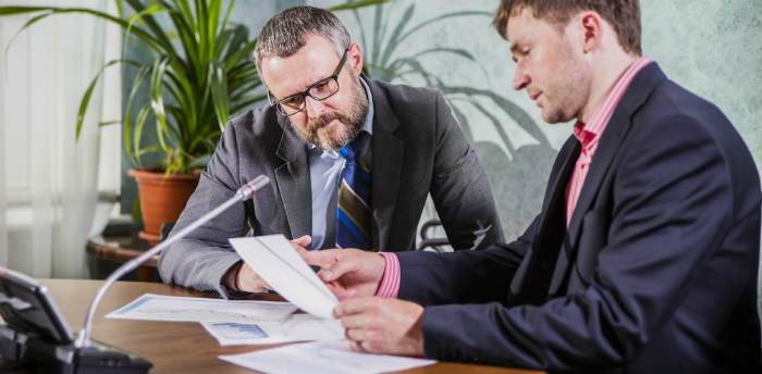 Our New Jersey expungement lawyers reviewing a case.