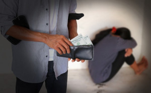 A man stealing money after sexually assaulting a woman.