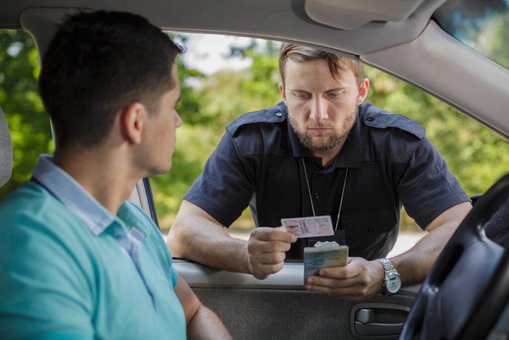 Police officer checking face ids.