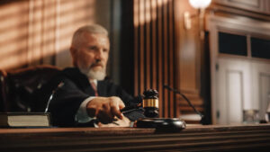Court judge using gavel for verdict decision.