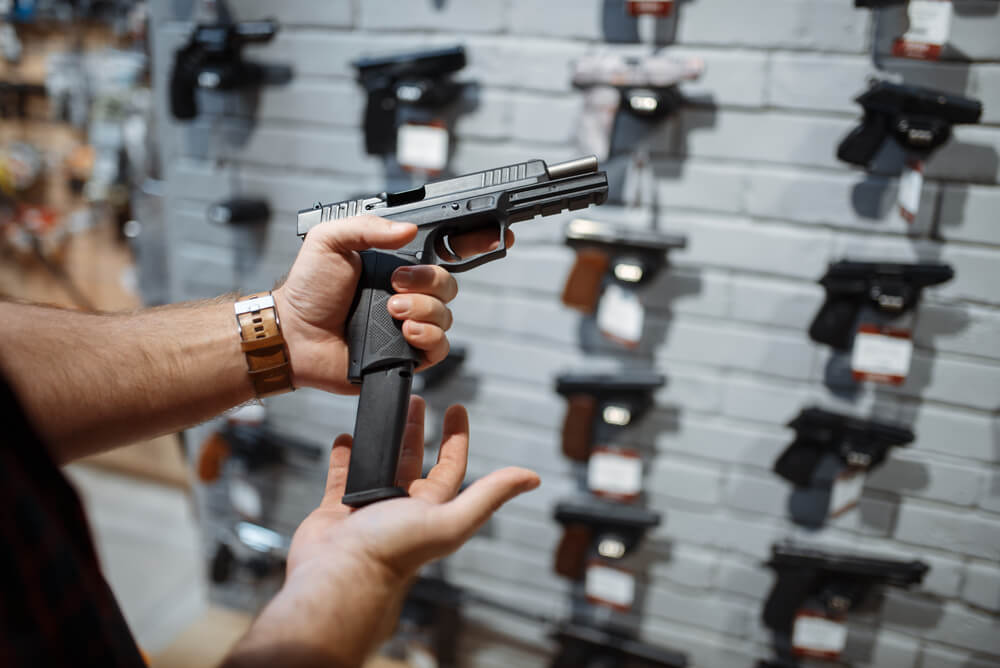 Man carrying handgun in the store.