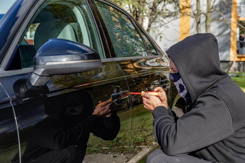 Attempted to steal a car using a suitcase in the city center.