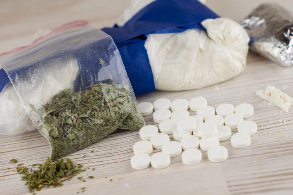 Dangerous substances like cocaine, heroin, spice, marijuana, and etc - many unknown pills, white powder in a transparent package and the foil.